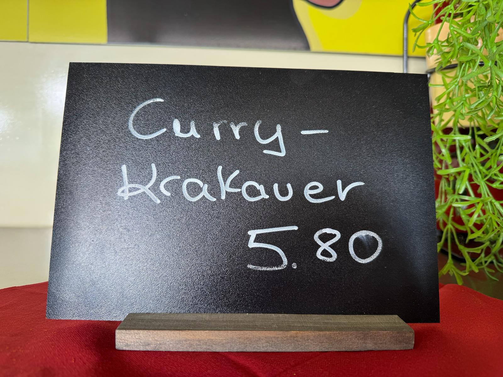 Tafel: Curry-Krakauer – Die Pommes Box Kerpen